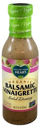 photo of organic vegan balsamic vinaigrette by follow your heart in glass container with screw on plastic cap packaging and cream, purple and blue paper label